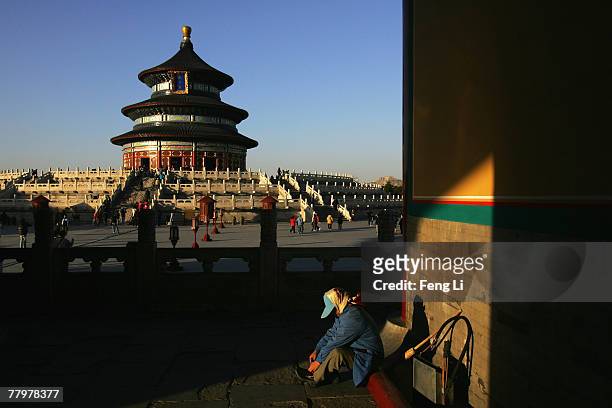 Cleaner has a rest by the Hall of Prayer for Good Harvests at the Temple of Heaven on November 19, 2007 in Beijing, China. Beijing Tourism Bureau...