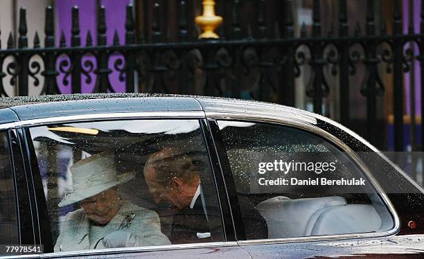 Queen Elizabeth II and the Duke of Edinburgh share a moment whilst departing from a ceremony celebrating their 60th Diamond anniversary at...