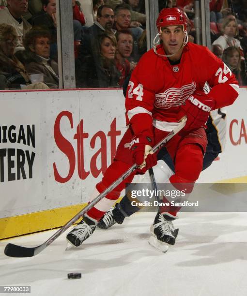 Chris Chelios of the Detroit Red Wings skates with the puck against the Nashville Predators at Joe Louis Arena on November 7, 2007 in Detroit,...