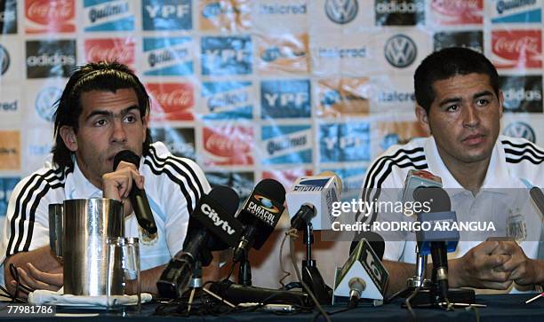 Argentine striker Carlos Tevez and teammate Juan Roman Riquelme offer a press conference before the beginning of a practice session in Bogota, on...