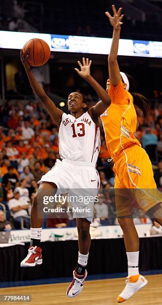 Freshman Point Guard Danielle Robinson of the Oklahoma Sooners goes up strong on Candace Parker of the Tennessee Volunteers during the game on...