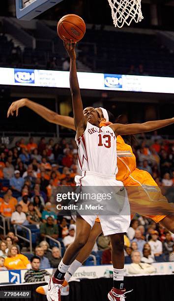 Freshman Point Guard Danielle Robinson of the Oklahoma Sooners goes up strong on Candace Parker of the Tennessee Volunteers during the game on...