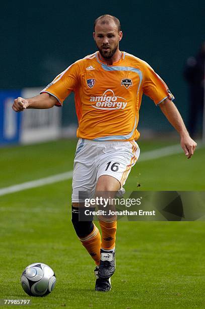 Craig Waibel of the Houston Dynamo handles the ball against the New England Revolution by a score of 2-1 to win the 2007 Major League Soccer Cup at...