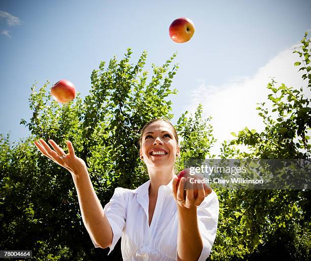 Throwing An Apple Photos and Premium High Res Pictures - Getty Images