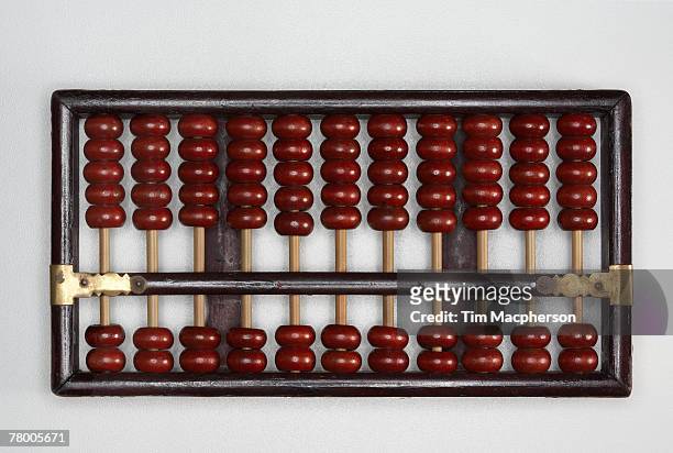 abacus sitting on a tabletop. - accounting abacus stock pictures, royalty-free photos & images