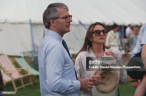 British Prime Minister John Major with writer Frances Edmonds at the first match to be played at John Paul Getty Jr's new cricket ground on his...