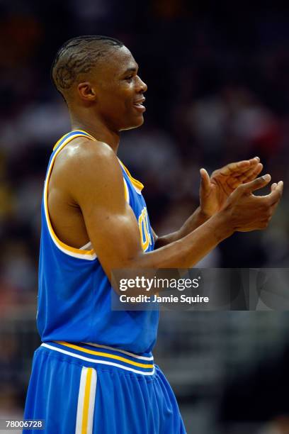 Russell Westbrook of the UCLA Bruins claps as the Bruins defeat the Maryland Terrapins during the O'Reilly Auto Parts CBE Classic semifinal game on...