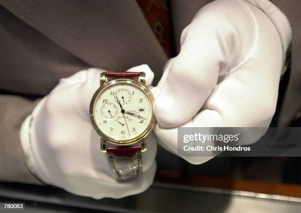 Tourneau Time Machine employee Pellegrino John Bongiovi sets one of the 20,000 watches in the Manhattan watch store ahead an hour for the onset of...