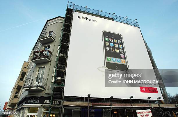 Giant billboard features an ad for Apple's iPhone in Berlin 19 November 2007. Exclusive iPhone distributor in Germany Deutsche Telekom said they had...