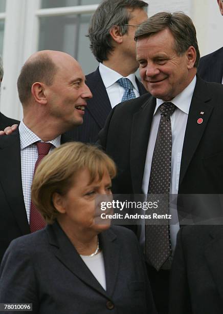 German Transport Minister Wolfgang Tiefensee, German Chancellor Angela Merkel and Deutsche Bahn CEO Hartmut Mehdorn pose for a family photo at...