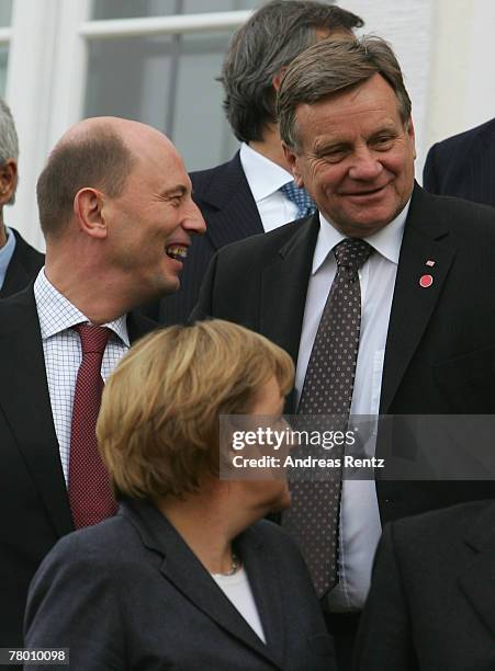 German Transport Minister Wolfgang Tiefensee, German Chancellor Angela Merkel and Deutsche Bahn CEO Hartmut Mehdorn pose for a family photo at...