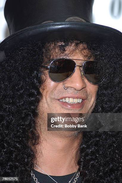 Slash guitarist for Guns N' Roses and Velvet Revolver signs copies of his book "Slash" at Bookends Bookstore on November 1, 2007 in Ridgewood, New...