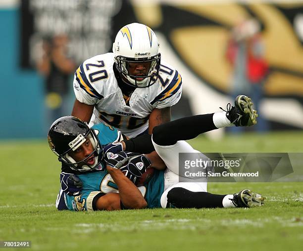 Dennis Northcutt of the Jacksonville Jaguars makes a catch against Marlon McCree of the San Diego Chargers at Jacksonville Municipal Stadium on...