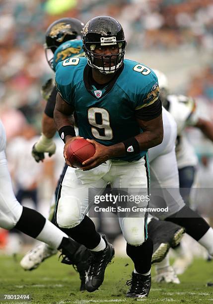 David Garrard of the Jacksonville Jaguars hands off the ball in a game against the San Diego Chargers at Jacksonville Municipal Stadium on November...