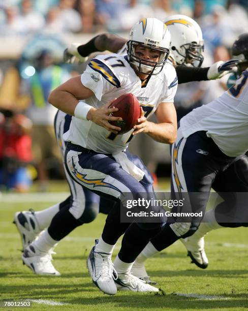 Philip Rivers of the San Diego Chargers hands off the ball in a game against the Jacksonville Jaguars at Jacksonville Municipal Stadium on November...