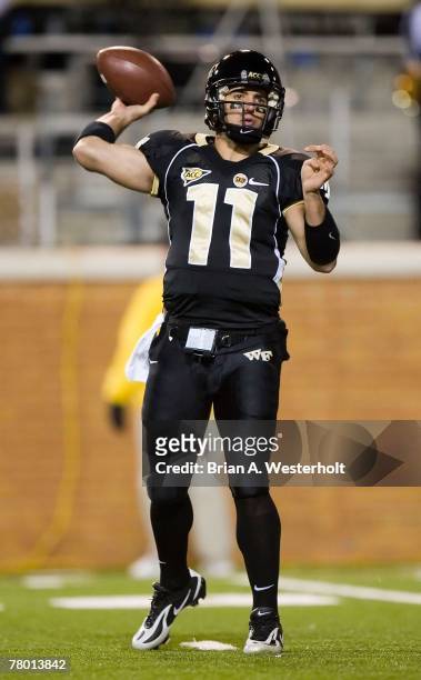 Riley Skinner of the Wake Forest Demon Deacons looks to pass versus the North Carolina State Wolfpack at BB&T Field November 17, 2007 in...
