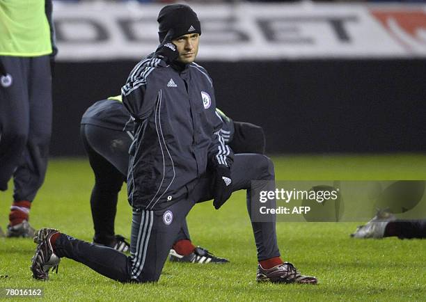 Football player Lativain Maris Verpakovskis kneels during the national Latvian soccer team training at the Rasunda stadium in Stockholm, 20 November...