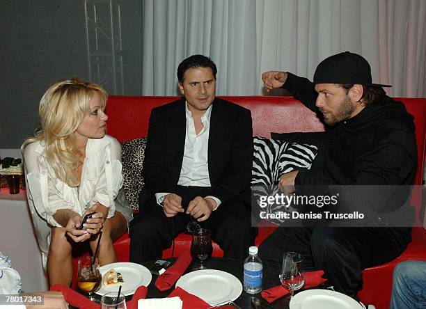 Actress Pamela Anderson, Andrew Sasson and Rick Salomon at Planet Hollywood Resort & Casino's Grand Opening Weekend on November 16, 2007 in Las...