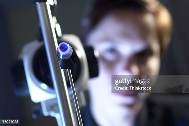 ophthalmologist with slit lamp - slit lamp stock pictures, royalty-free photos & images