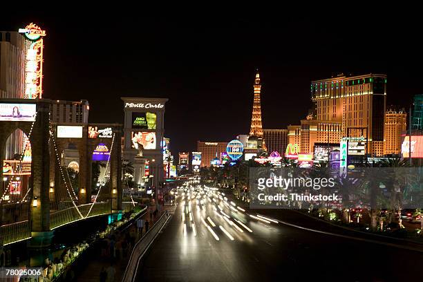 streaked lights on the streets and city lights at night in las vegas, nevada - the strip las vegas stock pictures, royalty-free photos & images