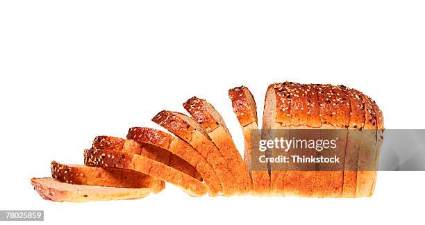 still life of a sliced loaf of bread. - sliced bread stock pictures, royalty-free photos & images