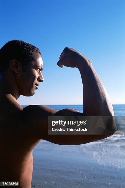 thb0008683 - group of people flexing biceps stock pictures, royalty-free photos & images