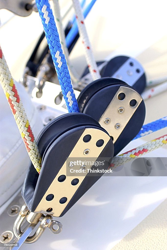 Close-up of ropes and pullies on a sailboat.