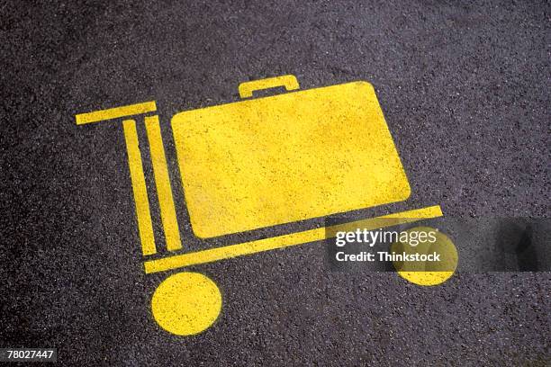 close-up of a symbol for luggage carts painted on the street at the zurich airport - airport tarmac stock illustrations