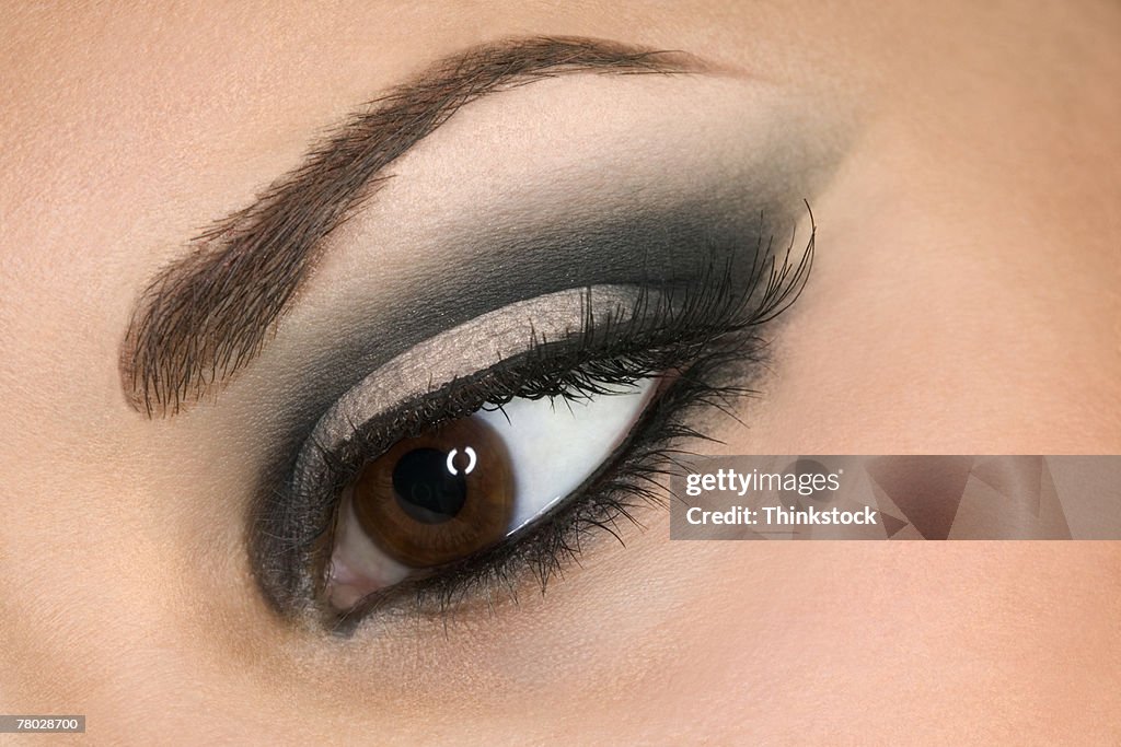 Close-up of a woman's open eye with make-up and mascara.