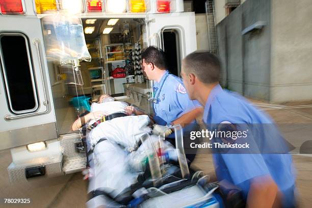 Loading Ambulance 781 Action Ambulance Paramedics Stock Photos, High-Res Pictures, and ...