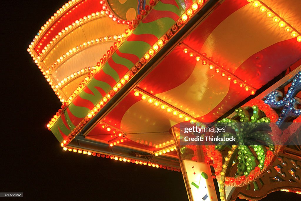 Close-up of lights and patterns at an amusement park or fairground.