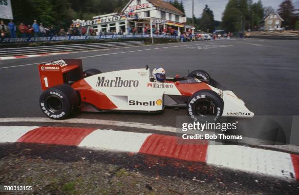 French racing driver Alain Prost drives the Marlboro McLaren International McLaren MP4/3 TAG/Porsche V6t to finish in first place to win the 1987...
