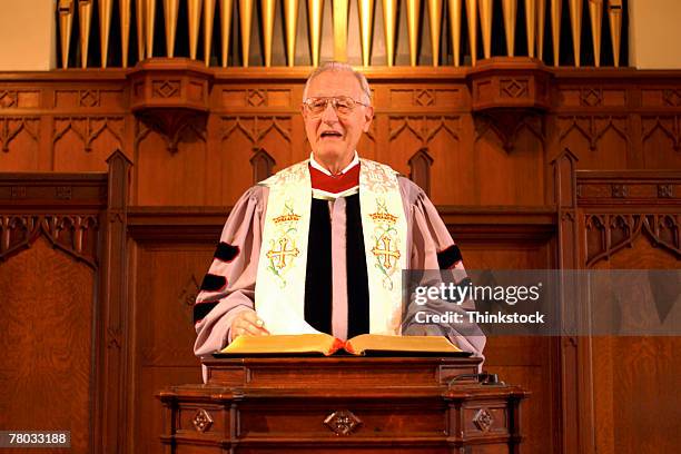 a minister giving a sermon at the pulpit in church. - pulpit stock pictures, royalty-free photos & images