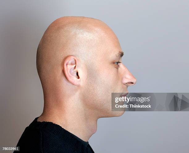 profile headshot of a bald man with his eyes closed - baldness stock pictures, royalty-free photos & images