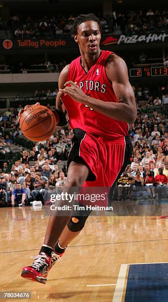 Chris Bosh of the Toronto Raptors drives to the basket against the Dallas Mavericks on November 20, 2007 at the American Airlines Center in Dallas,...