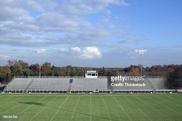 football field and bleachers - american football field stock pictures, royalty-free photos & images