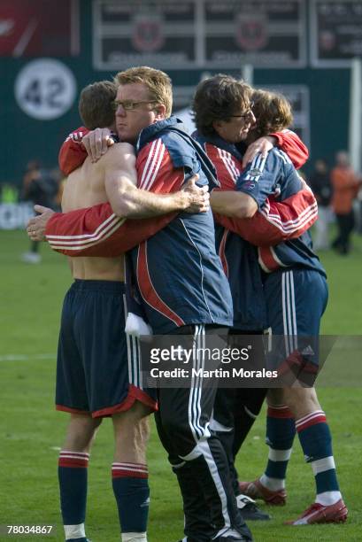 Coaches Steve Nicol and Paul Mariner console players Steve Ralston and WellsThompson after defeat at the 2007 Major League Soccer Cup at RFK Stadium...