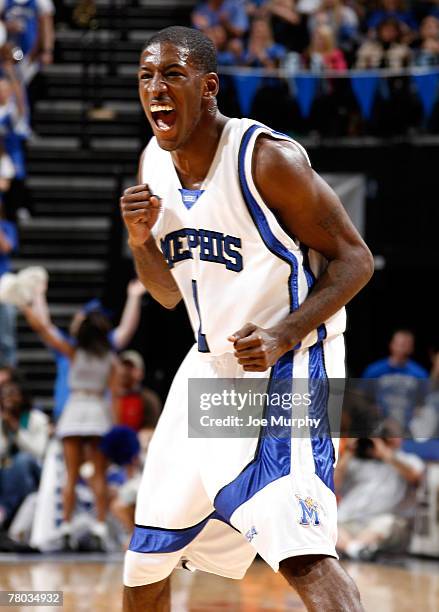 Willie Kemp of the Memphis Tigers celebrates after making his third consecutive 3-point basket against the Arkansas State Indians at FedExForum on...