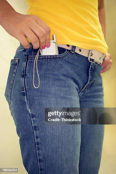 cell phone in pocket - bolso imagens e fotografias de stock