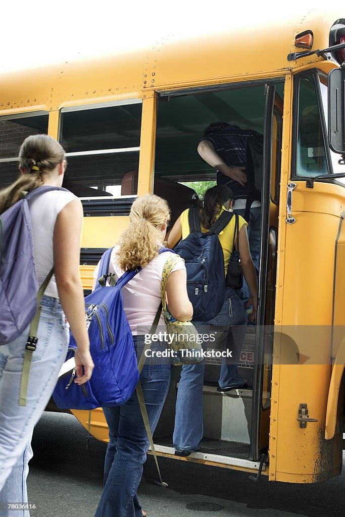 Students getting on school bus