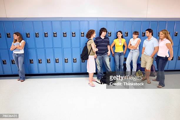 teenagers ignoring girl - cliqueimages stock pictures, royalty-free photos & images