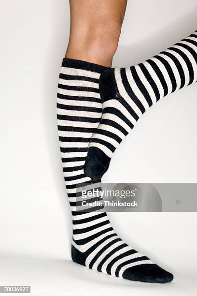 Female Legs with Striped Stockings (2) Stock Photo by