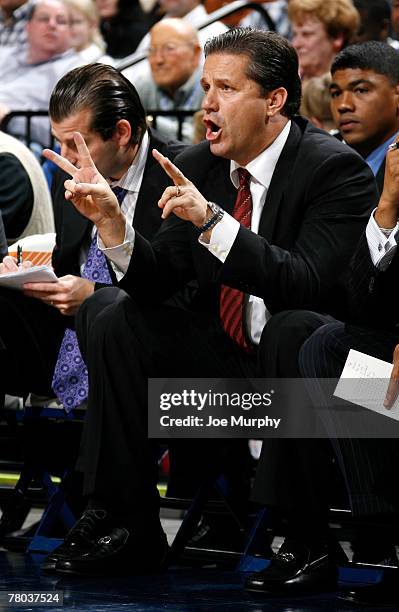 John Calipari, head coach of the Memphis Tigers gives instructions from the bench during a game against the Arkansas State Indians at FedExForum on...