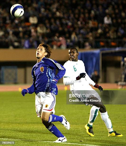 Hajime Hosogai of Japan fights for the ball against Abdulmarek Abdullah Al Khaibri of Saudi Arabia during 2008 Beijing Olympic Qualifier final round...