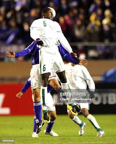 Abdulmalek Abdullah Al Khaibri of Saudi Arabia goes up for a header against Toshihiro Aoyama of Japan during 2008 Beijing Olympic Qualifier final...
