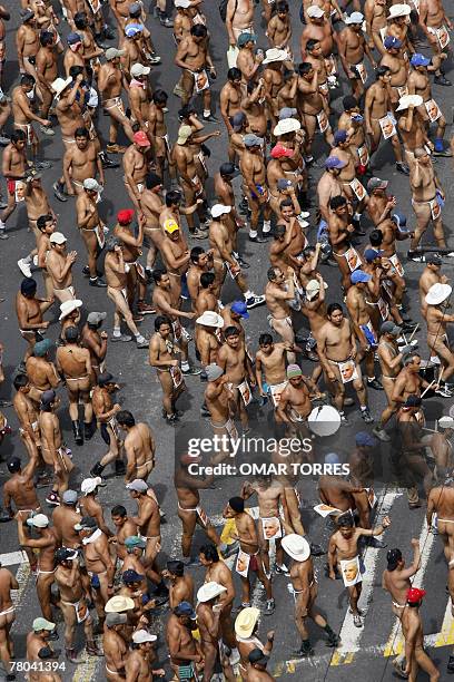 Peasants members of the "400 Pueblos" movement strip off to stand a protest against the dispossession of their lands in the state of Veracruz,...