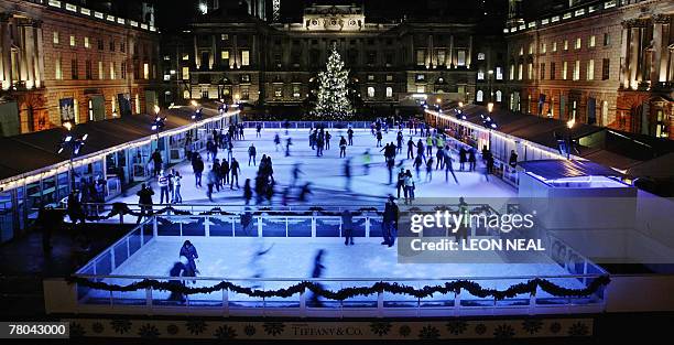 Members of the public enjoy the ice on the first day of opening for the annual skating rink at Somerset House in central London, 21 November 2007....