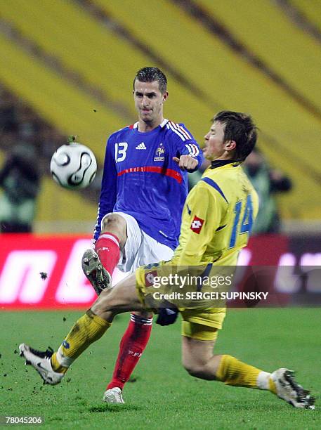 Ukraine's Ruslan Rotan fights for a ball with France's Francois Clerc during their Euro 2008 qualifying football match Ukraine vs. France. France is...