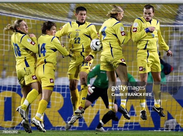 Ukraine's defenders Oleksandr Grytsay and Anatoly Tymoshcuk stop the ball during their Euro 2008 qualifying football match Ukraine vs. France. France...