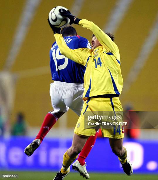 Ukraine's midfielder Ruslan Rotan stops the ball in front of France's forward Hatem Ben Arfa during their Euro 2008 qualifying football match Ukraine...